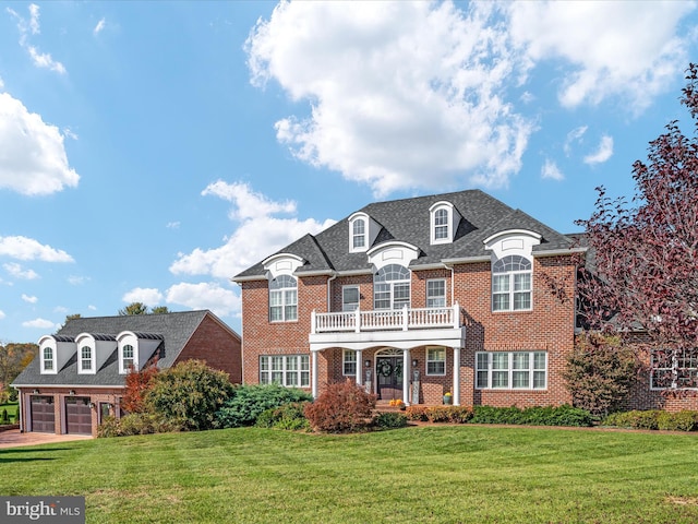 view of front of house featuring a front yard and a garage