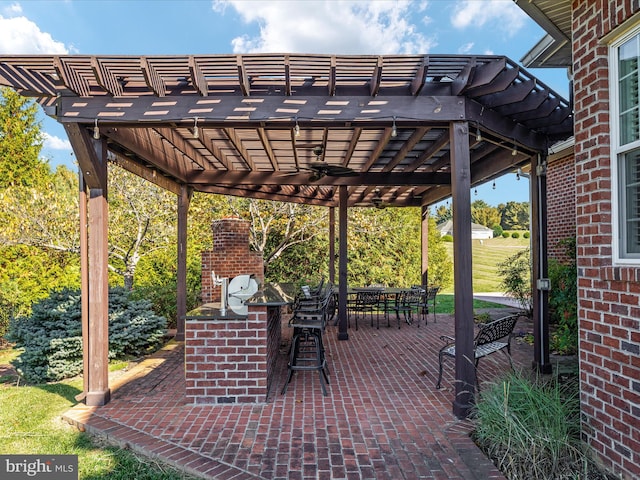 view of patio / terrace featuring ceiling fan and a pergola