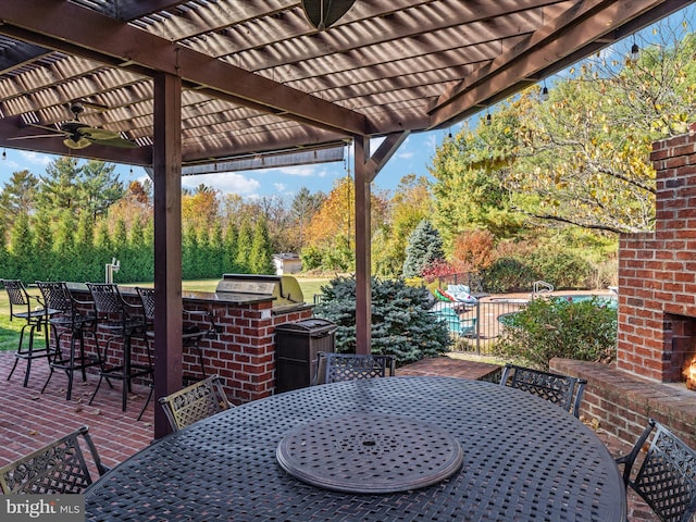 view of patio with ceiling fan, a grill, and a pergola