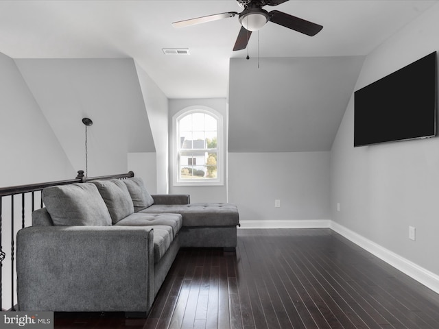 unfurnished living room with dark hardwood / wood-style floors, ceiling fan, and vaulted ceiling