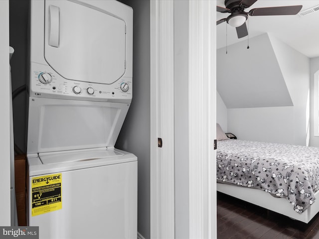 washroom with stacked washer / dryer, dark hardwood / wood-style floors, and ceiling fan