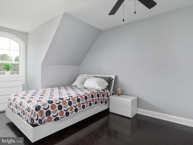 bedroom featuring lofted ceiling, wood-type flooring, and ceiling fan