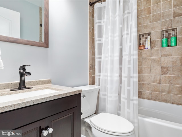 full bathroom featuring toilet, vanity, and shower / bath combination with curtain