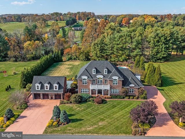 birds eye view of property featuring a rural view