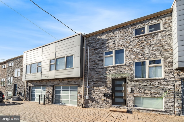 view of front of property with a garage