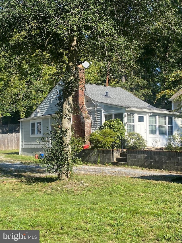 exterior space featuring a lawn