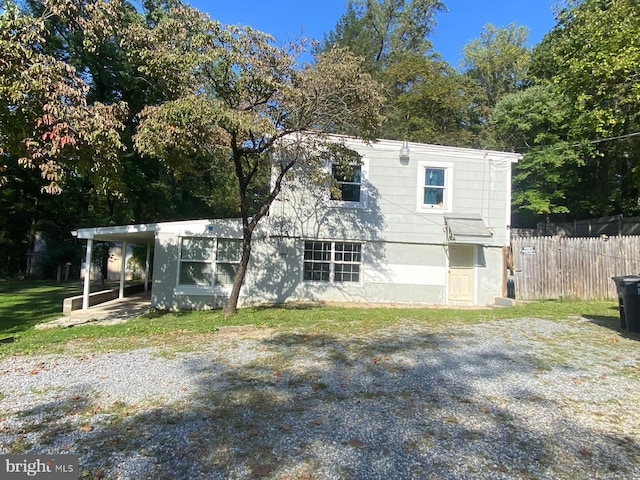 exterior space featuring a carport