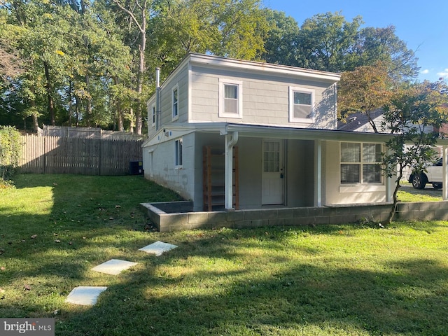 exterior space featuring cooling unit and a yard