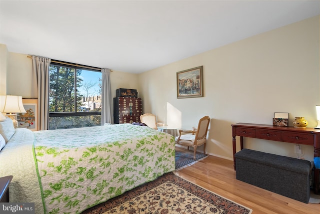 bedroom with light wood-type flooring