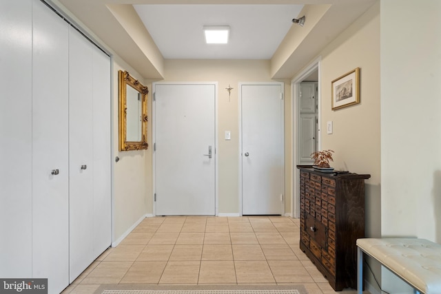 corridor with light tile patterned flooring