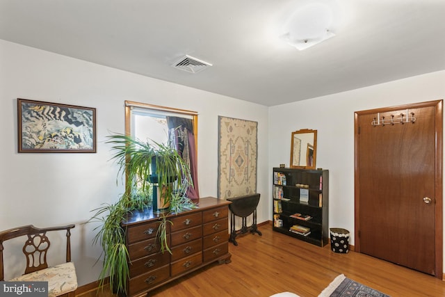 living area with light hardwood / wood-style floors