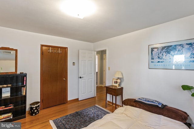 bedroom with light wood-type flooring