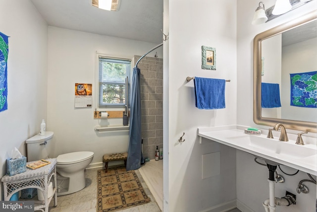 bathroom featuring tile patterned flooring, toilet, and curtained shower