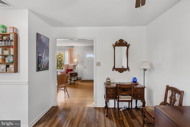 corridor featuring dark hardwood / wood-style floors