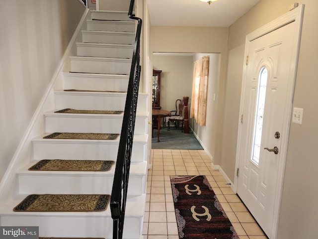 foyer with light tile patterned floors