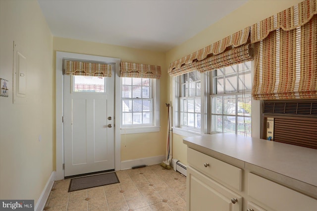 entryway with baseboards and baseboard heating