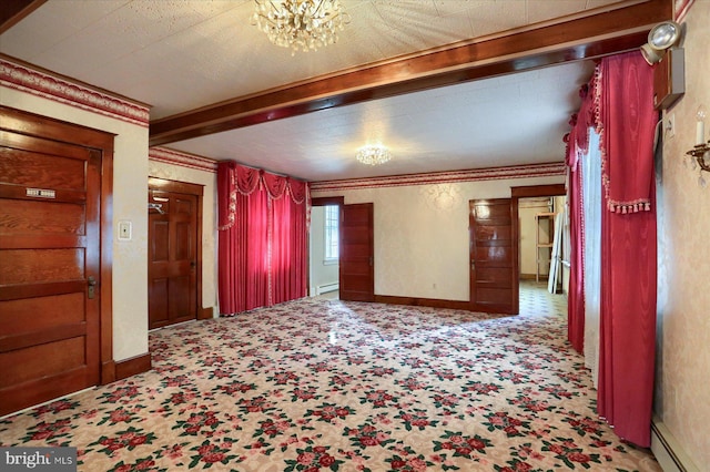 interior space with baseboards, beamed ceiling, and baseboard heating