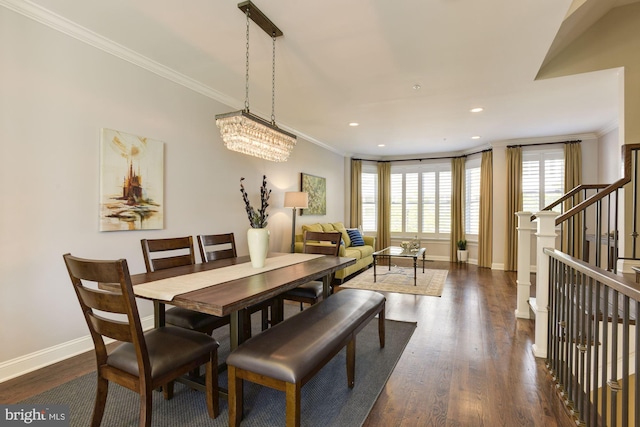 dining space featuring ornamental molding and dark hardwood / wood-style floors