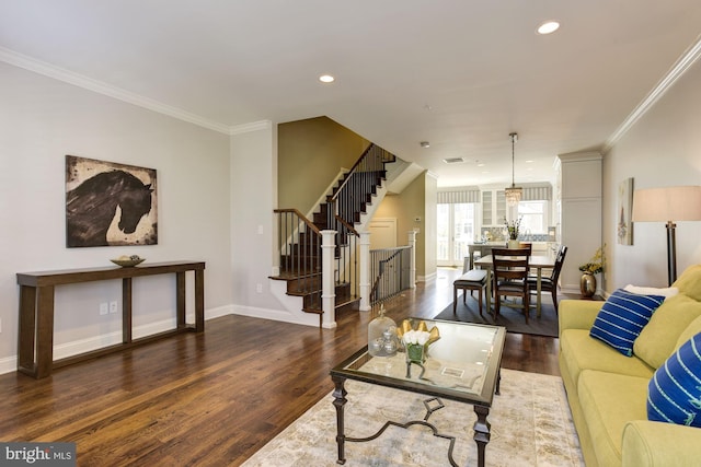 living room featuring dark wood-type flooring and ornamental molding