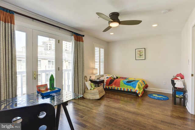 bedroom featuring access to exterior, multiple windows, dark hardwood / wood-style floors, and ceiling fan