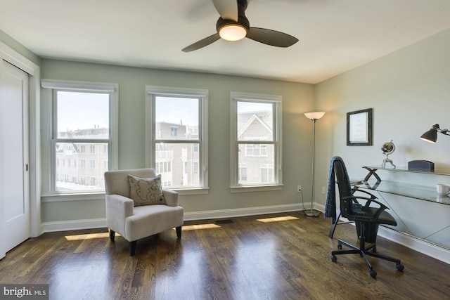 office with dark wood-type flooring and ceiling fan