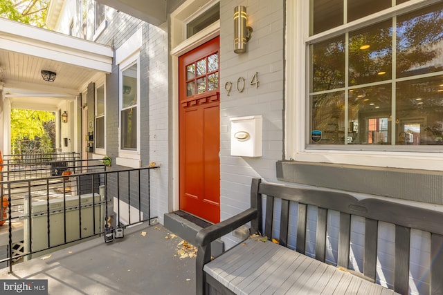 doorway to property featuring covered porch