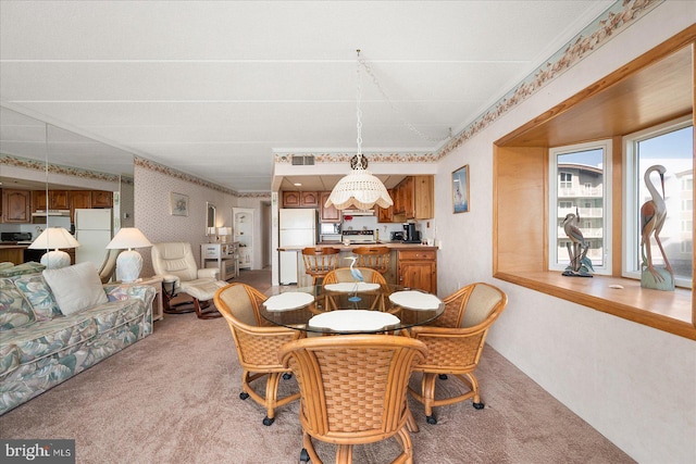 view of carpeted dining space