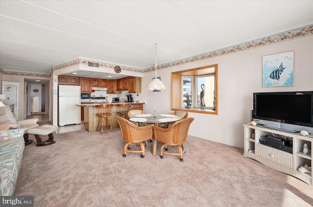 view of carpeted dining area