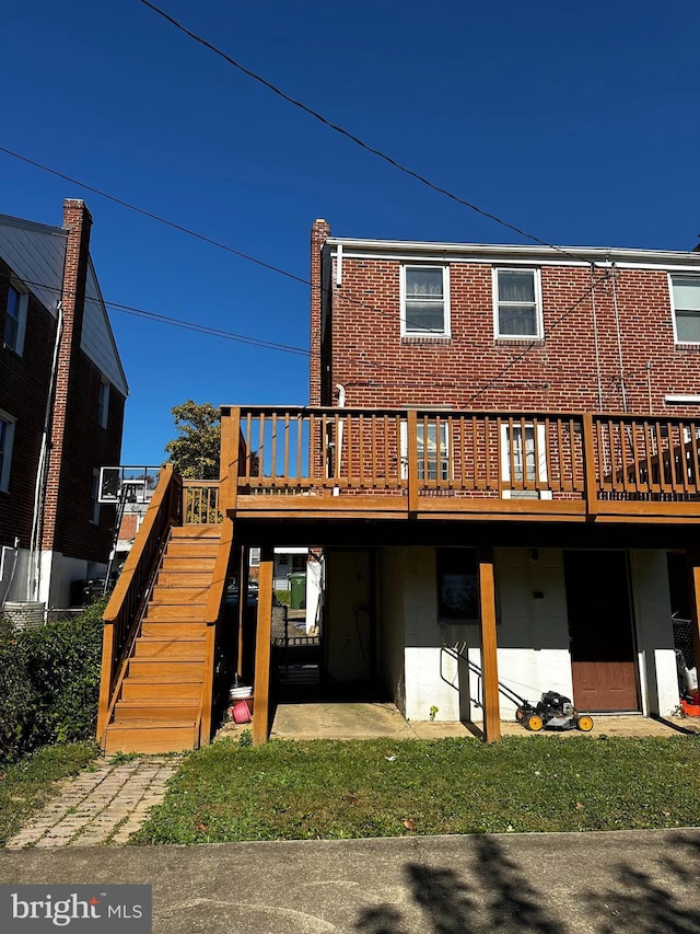 rear view of property with a deck