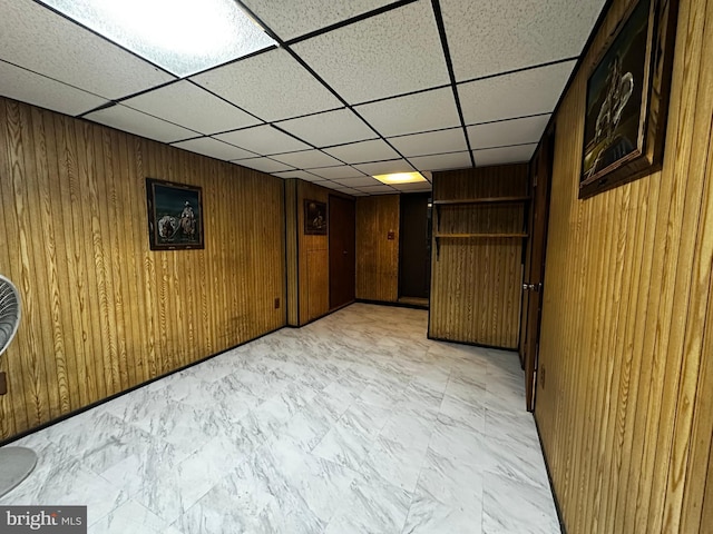 interior space featuring wooden walls