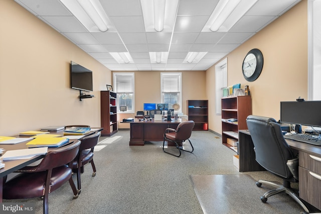 home office featuring a paneled ceiling