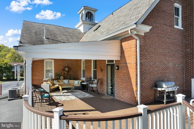 exterior space featuring area for grilling, outdoor lounge area, central AC unit, and a deck