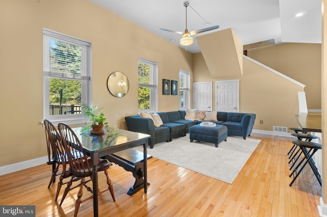 living room featuring light wood-type flooring and a wealth of natural light