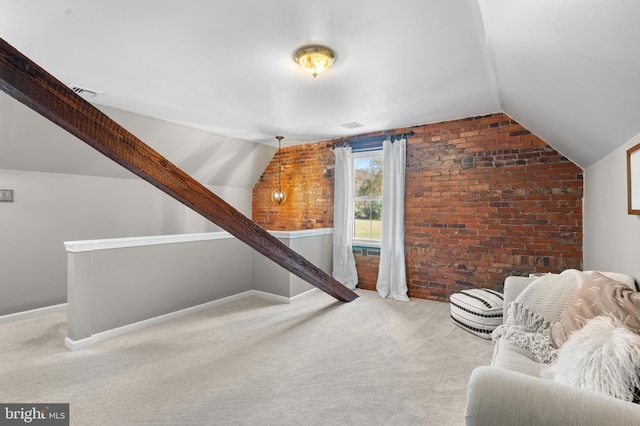 additional living space featuring carpet, lofted ceiling, and brick wall