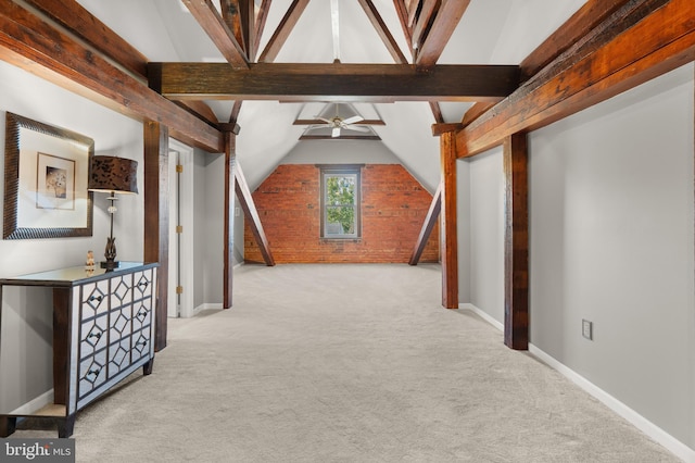 hall featuring light carpet and vaulted ceiling with beams