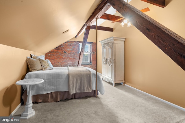 bedroom with ceiling fan, carpet, and lofted ceiling with beams