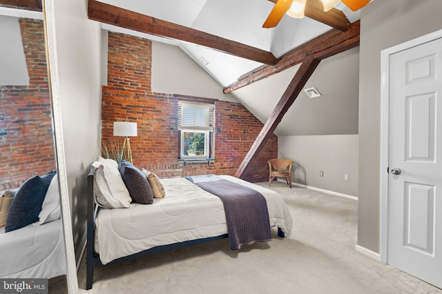 carpeted bedroom with vaulted ceiling with beams, ceiling fan, and brick wall