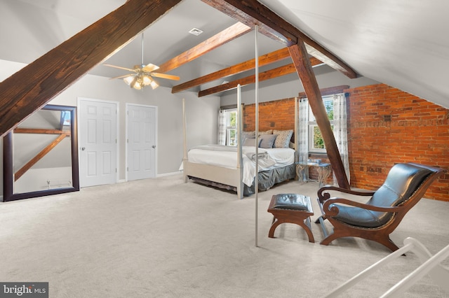 carpeted bedroom featuring vaulted ceiling with beams, ceiling fan, and brick wall