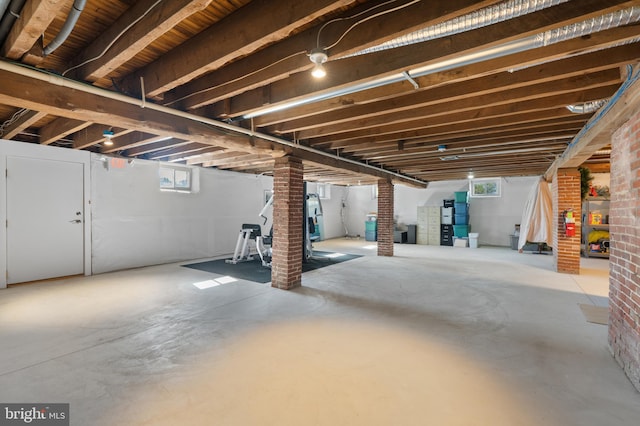 basement with brick wall