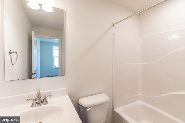 bathroom with toilet, shower / bathtub combination, and vanity