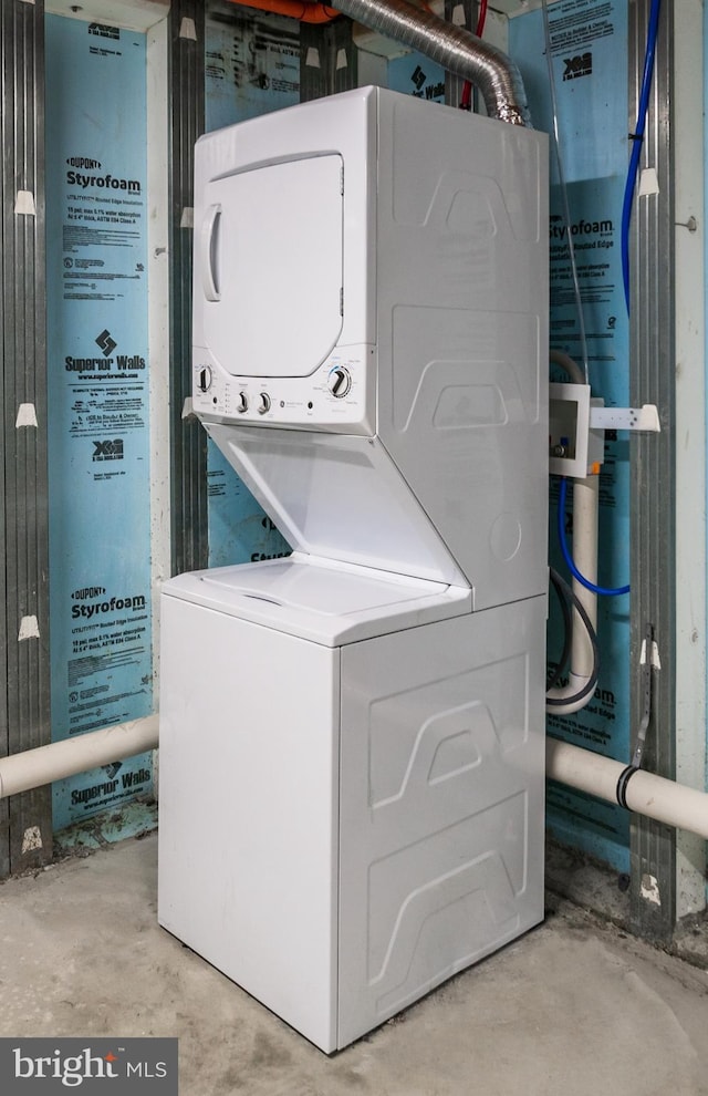 washroom featuring laundry area and stacked washer and clothes dryer