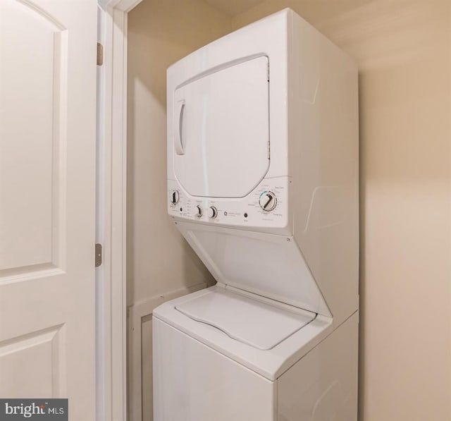 laundry area featuring stacked washer and clothes dryer