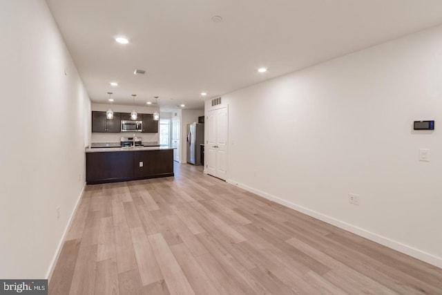 unfurnished living room featuring light hardwood / wood-style floors