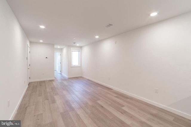 spare room with light hardwood / wood-style floors