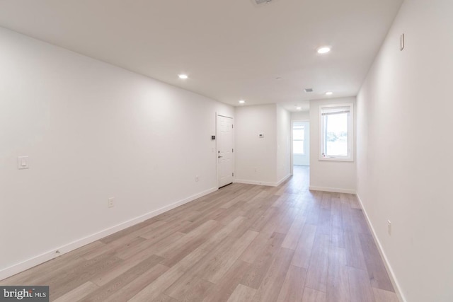 unfurnished room featuring light hardwood / wood-style flooring