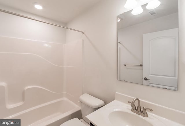 full bathroom with bathtub / shower combination, vanity, and toilet