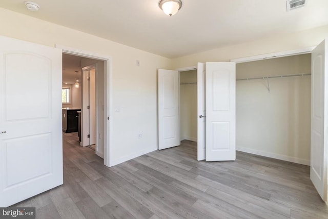 unfurnished bedroom featuring light hardwood / wood-style flooring