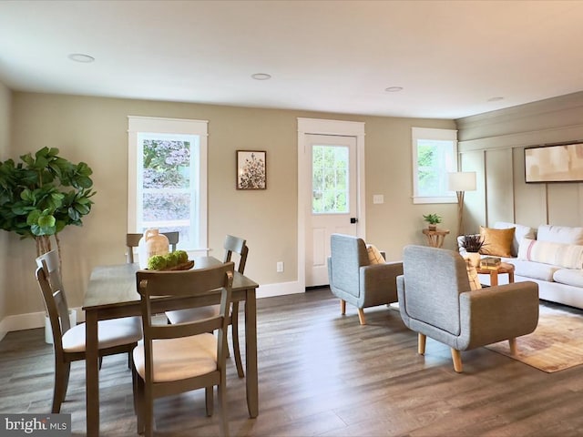 dining space featuring dark hardwood / wood-style flooring