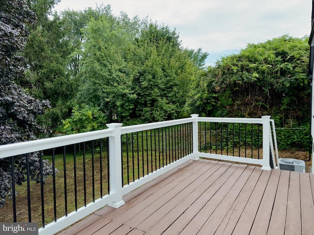 wooden terrace with a lawn