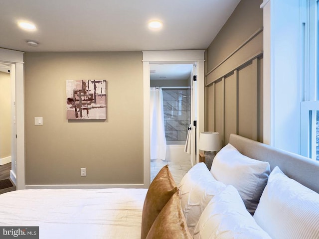 bedroom with a closet and ensuite bath